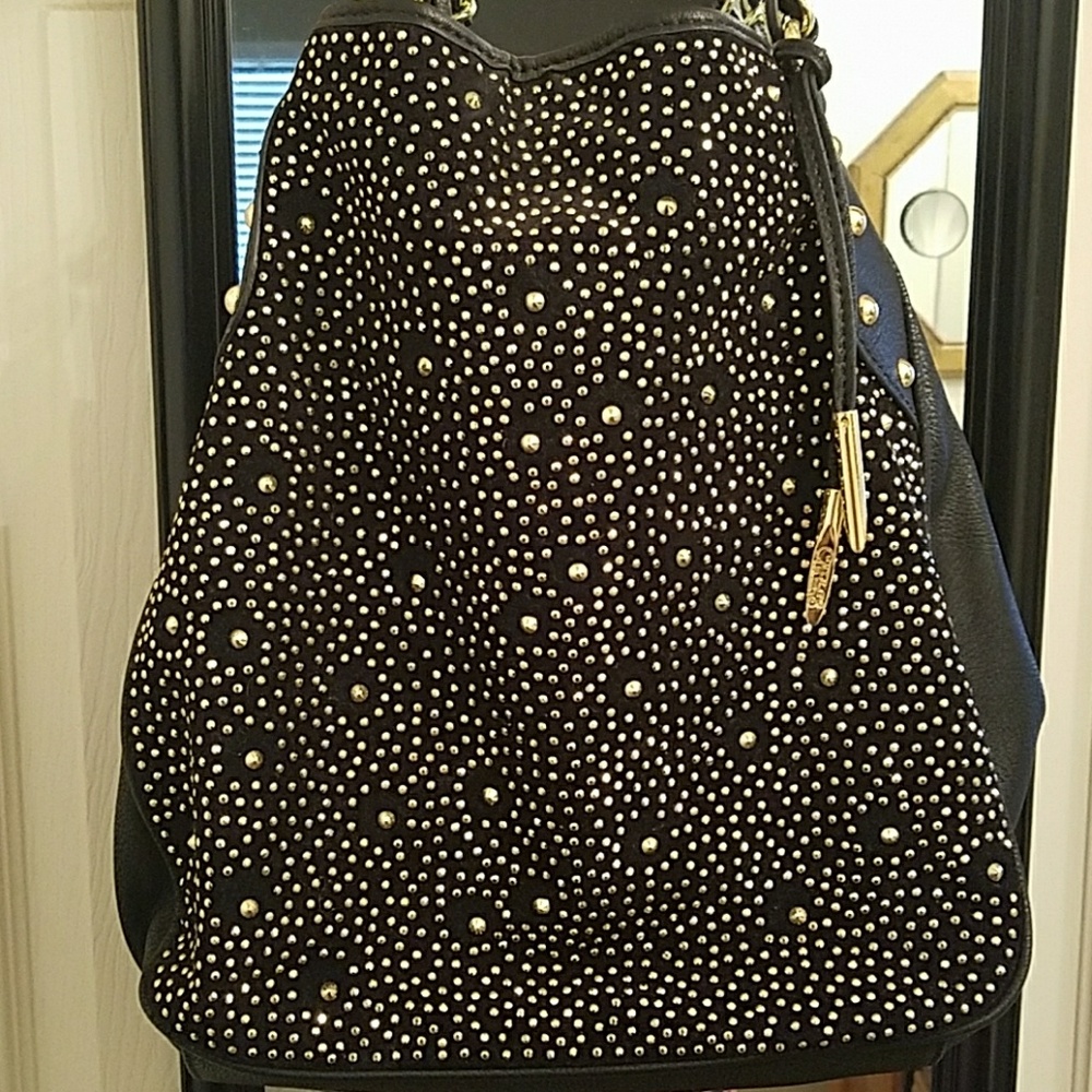 Carlos Santana black purse
